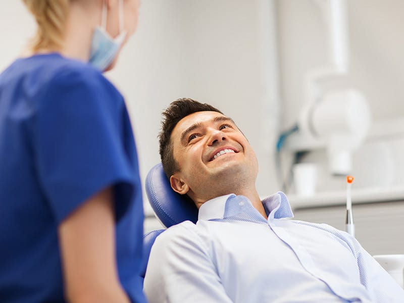 man being treated at the dentist